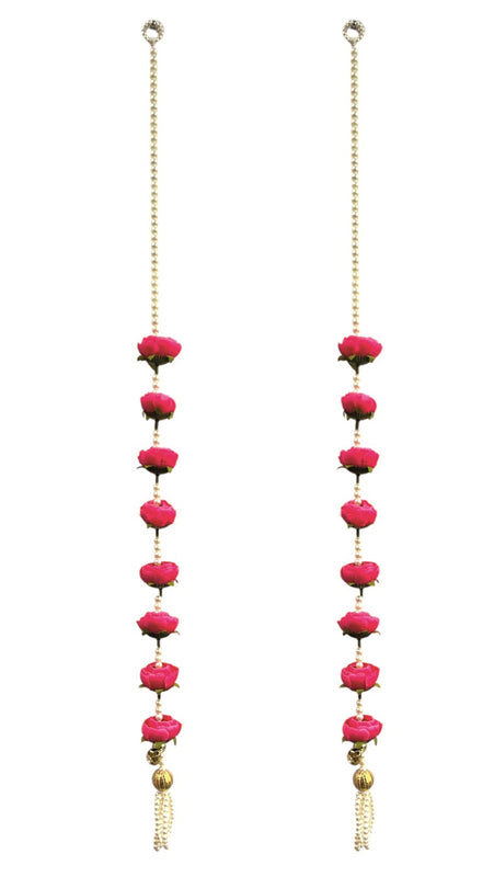 Decorative hanging chain with pink beads and gold tassels on a white background