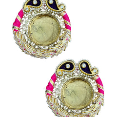 Decorative earrings with pink and gold accents on a white background
