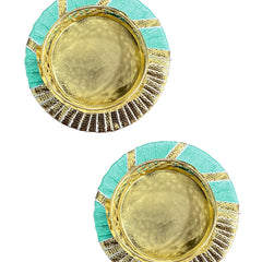 Pair of round earrings with gold center and green border on a white background