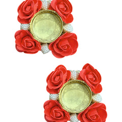 Pair of earrings with red rose petals and pearl-like beads on a white background