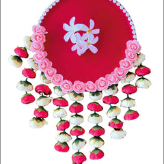 Decorative pink plate with floral design on a white background