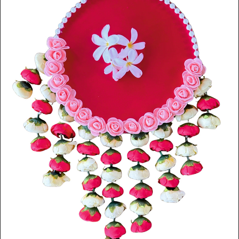 Decorative pink plate with floral design on a white background