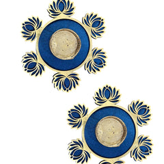Decorative blue and gold rings with floral patterns on a white background