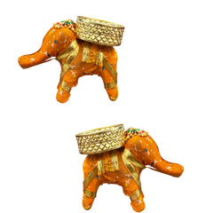 Two decorative elephant figurines with gold baskets on a white background