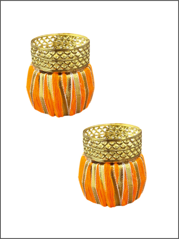 Two decorative candle holders with orange and gold striped design on a white background
