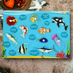 Children's educational puzzle with fish illustrations on a blue background