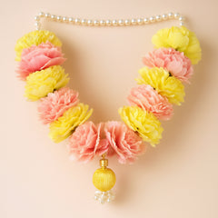 Floral necklace with pink and yellow flowers on a beige background