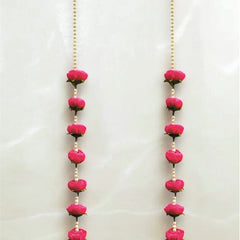 Two long necklaces with pink beads and gold chains on a white background