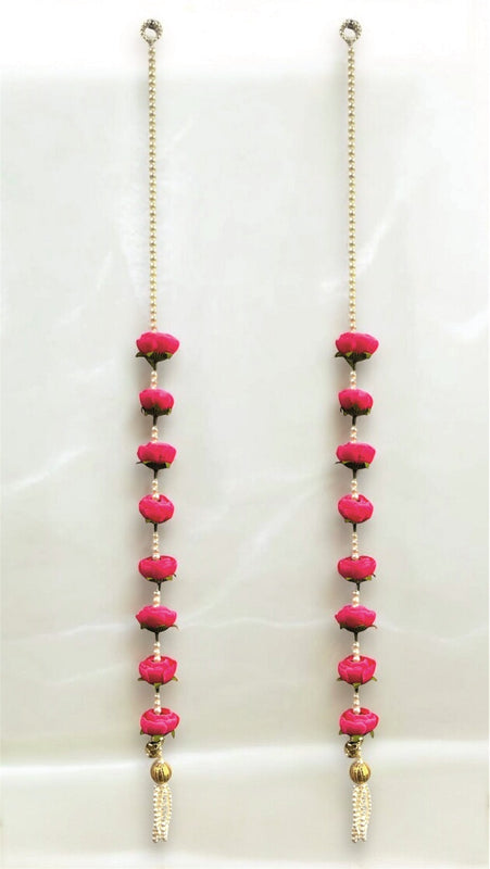 Two long necklaces with pink beads and gold chains on a white background