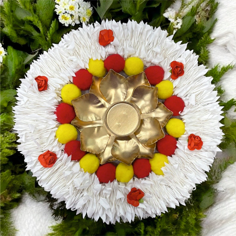 Decorative flower arrangement with a gold center on a green leaf background