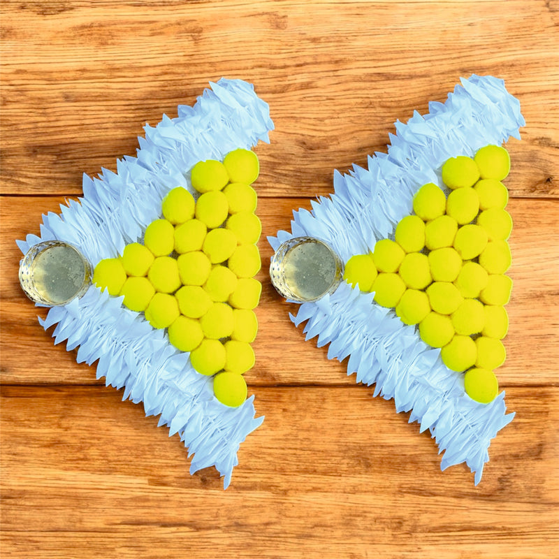Two blue and green pet toys on a wooden surface