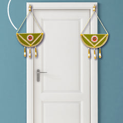 Decorative hanging on a white door with a teal background