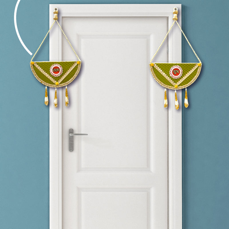 Decorative hanging on a white door with a teal background