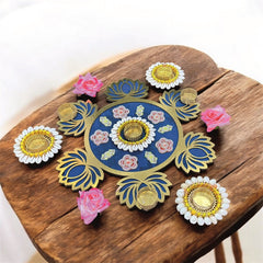 Decorative circular object with floral designs on a wooden surface