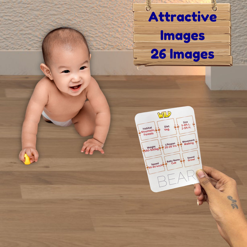 Baby crawling on a wooden floor with a person holding a card labeled 'WILD BEAR'.