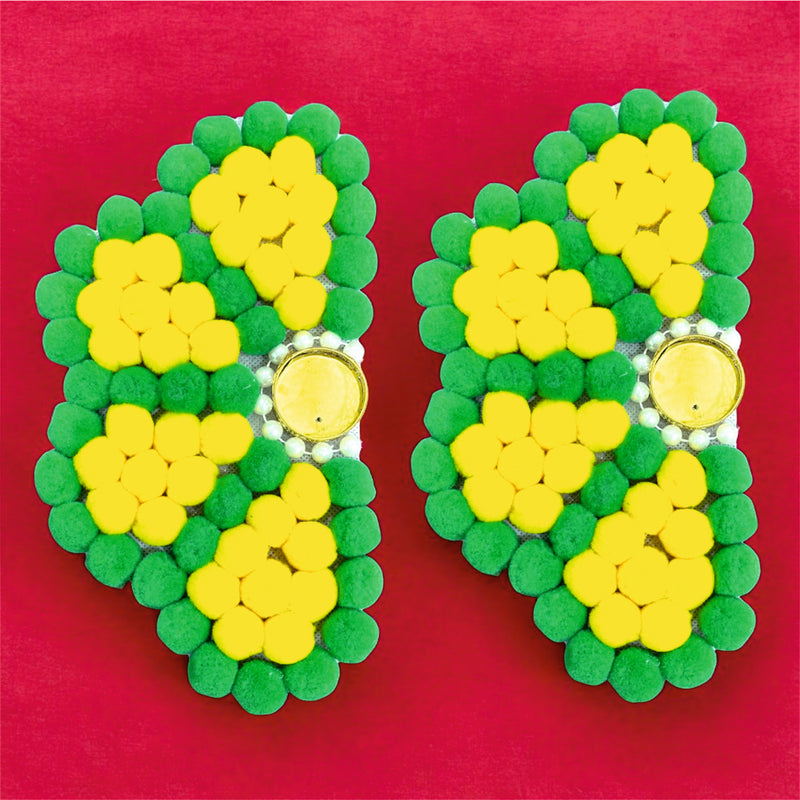 Green and yellow flip-flop sandals on a pink background