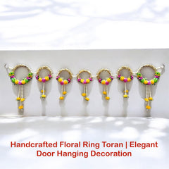 Handcrafted floral ring toran with colorful beads on a white background