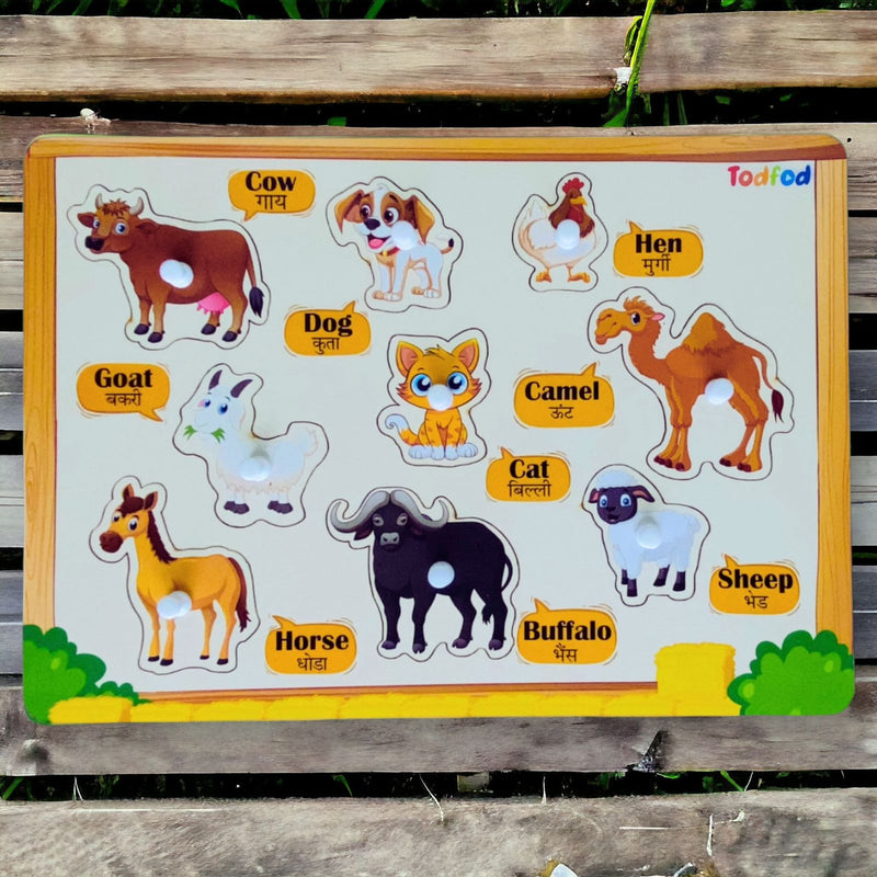 Educational animal puzzle with labels on a wooden background