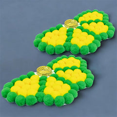 Green and yellow pom-pom slippers on a blue background