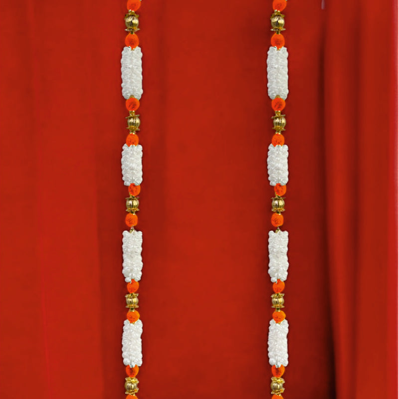 Decorative garlands with white flowers and red beads on a red background
