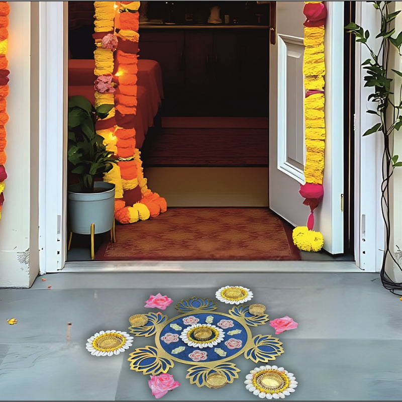 Decorative entrance with floral garlands and colorful rangoli on a floor.