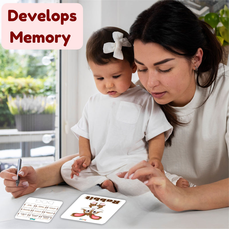 Woman and child playing with flashcards, with text 'Develops Memory' on a blurred outdoor background.