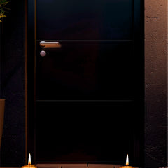 Dark door with candles on a stone surface