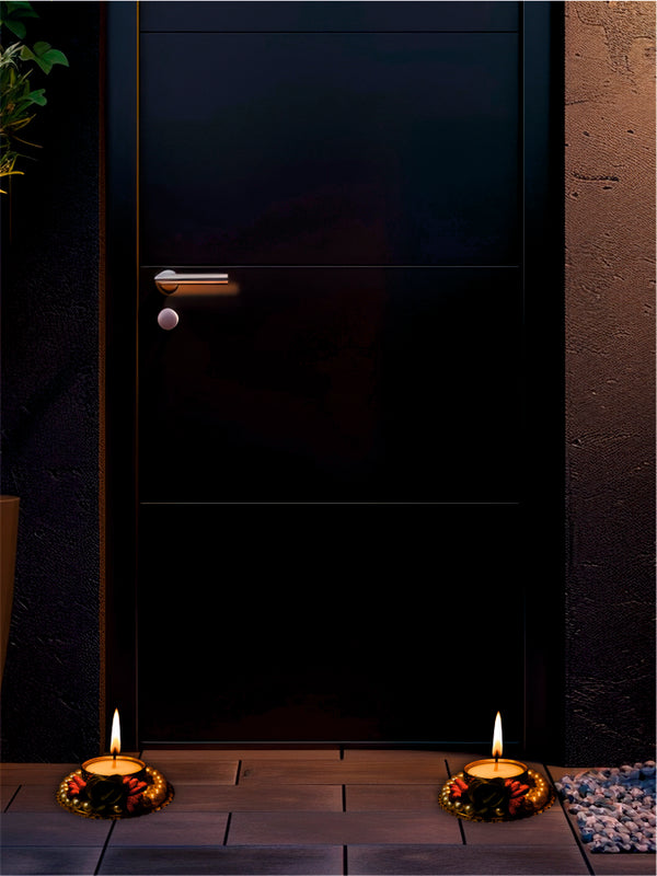 Dark door with candles on a stone surface