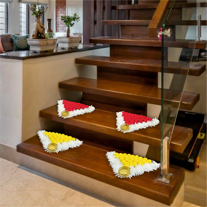 Decorative flower arrangements on a set of wooden stairs in a home setting.