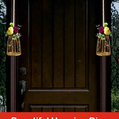 Decorative hanging diyas on a door with a festive background