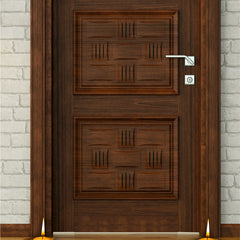 Wooden door with decorative patterns, two lit candles on either side, and a light gray brick wall background.