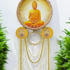 Decorative hanging with Buddha image and bells against a white background