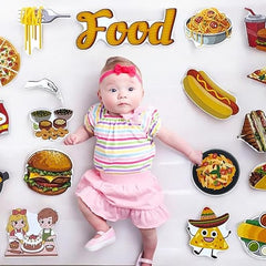 Baby surrounded by food-themed illustrations on a white background