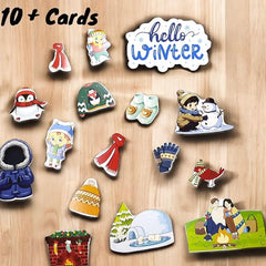 Collection of winter-themed cards and magnets on a wooden surface with 'hello Winter' text.