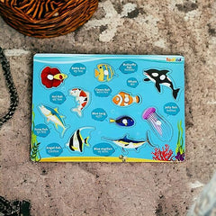Children's educational puzzle with fish illustrations on a textured surface