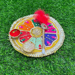 Decorative round object with colorful patterns on a grass background