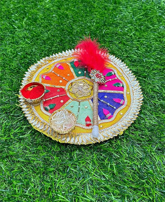 Decorative round object with colorful patterns on a grass background