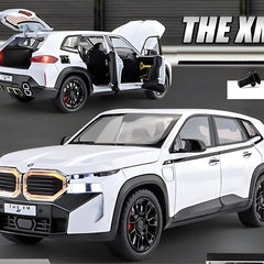 White SUV with open doors and 'THE XM' branding on a dark background