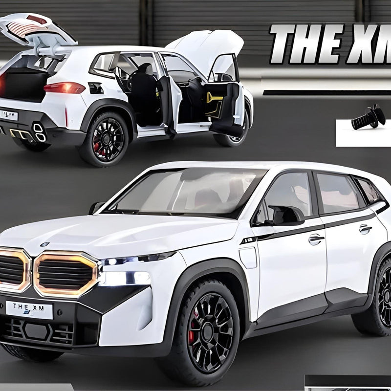 White SUV with open doors and 'THE XM' branding on a dark background