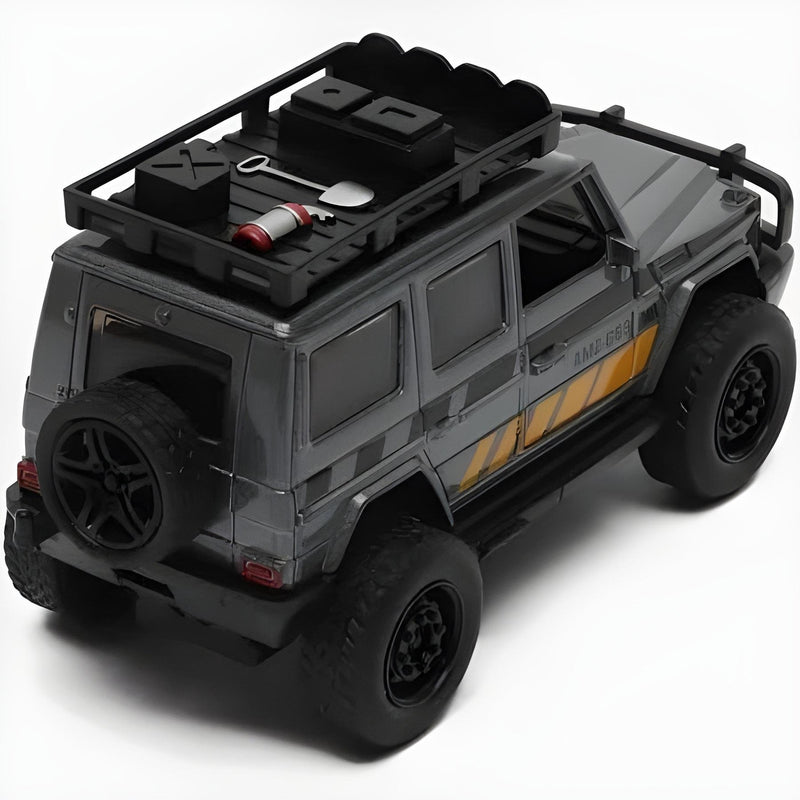 Model of a gray off-road vehicle with roof rack and tools on a white background