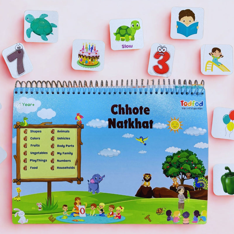 Children's educational book with flashcards on a pink background