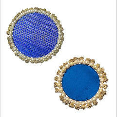 Pair of round blue earrings with gold and pearl-like embellishments on a white background