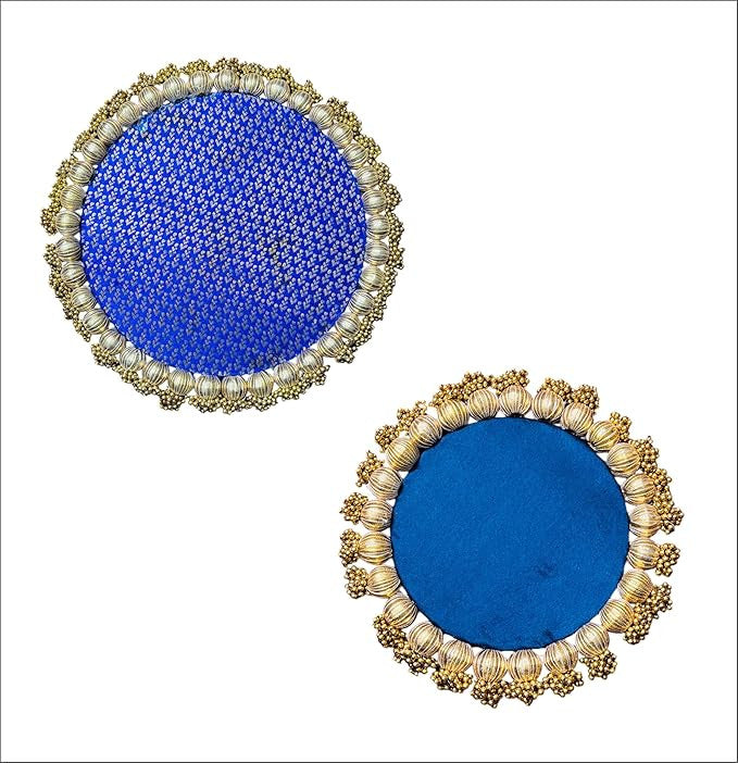 Pair of round blue earrings with gold and pearl-like embellishments on a white background