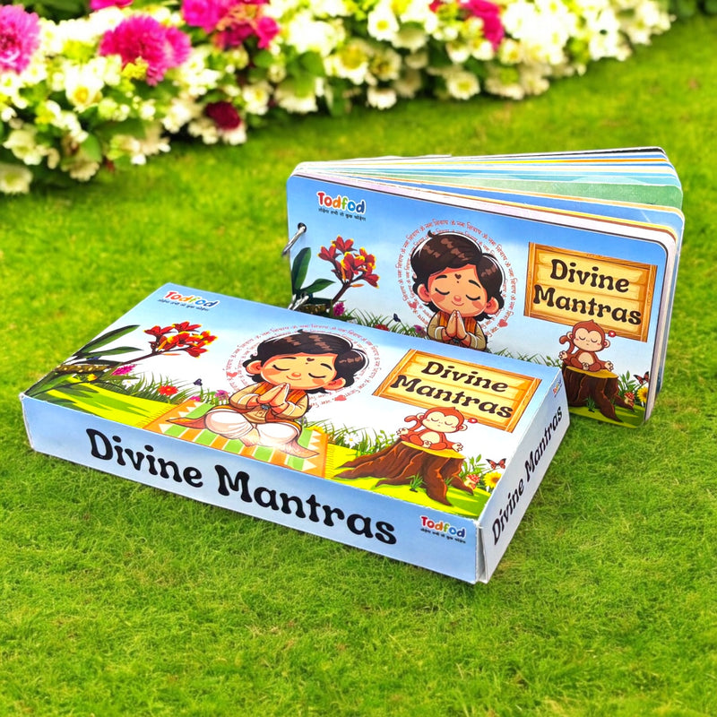 Two children's books titled 'Divine Mantras' on a grassy background with flowers.