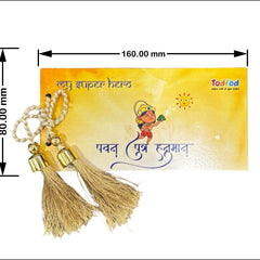 Decorative keychain with tassels on a yellow card featuring text and branding.
