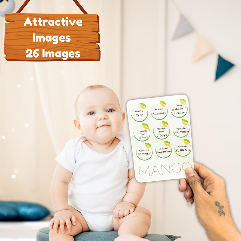 Baby holding a card with 'Mango' stickers in a room setting