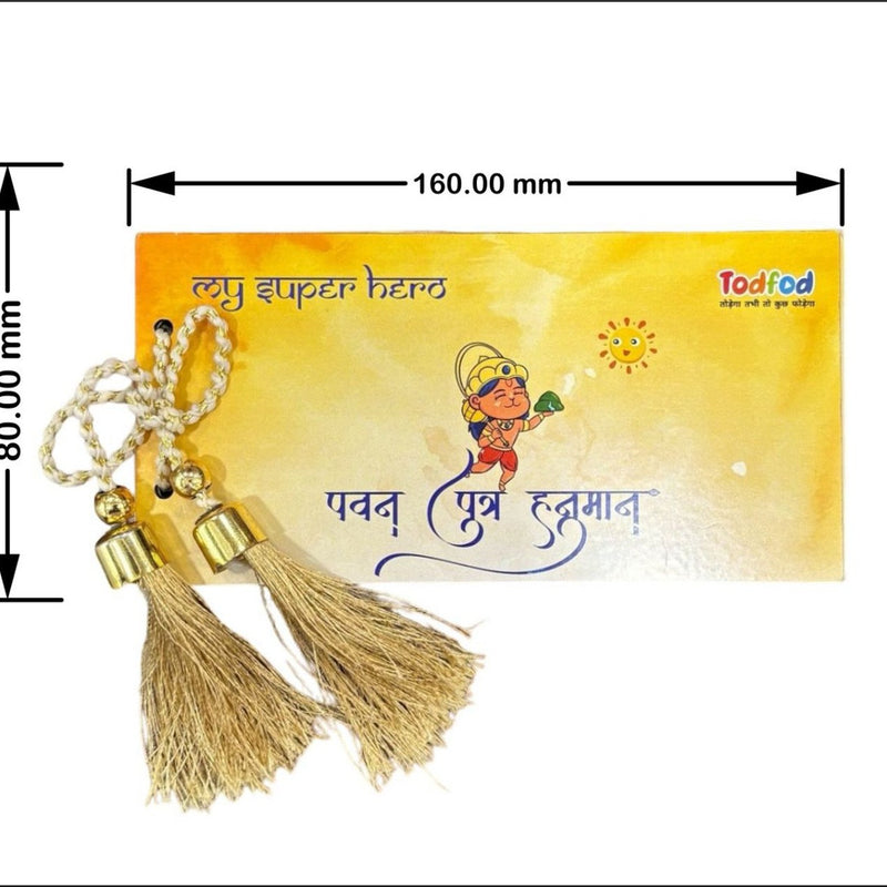 Decorative keychain with tassels on a yellow card featuring text and branding.