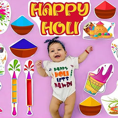 Baby wearing a 'Happy Holi Let's Play' shirt surrounded by Holi-themed illustrations on a pink background.