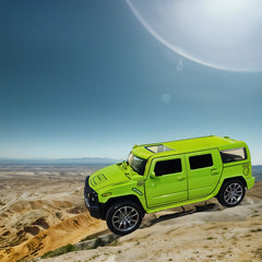 Green SUV on a desert landscape with clear blue sky