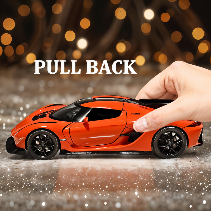 Orange toy car with a hand pulling it back against a blurred light background